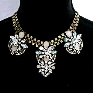 Brass chain link choker with 3 flower embellishment.